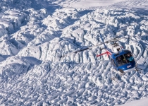 The Helicopter Line West Coast - Flying over a glacier